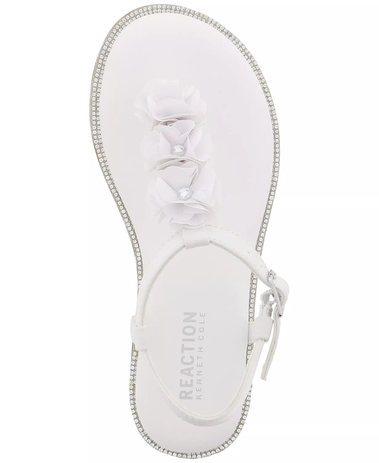 A cushioned insole adds comfort to these T-strap sandals from Kenneth Cole, styled with flower details and faux gem stones for extra flair. · Floral detailing · Buckle at back strap · Cushioned insole · Manmade upper and lining; rubber sole · Imported