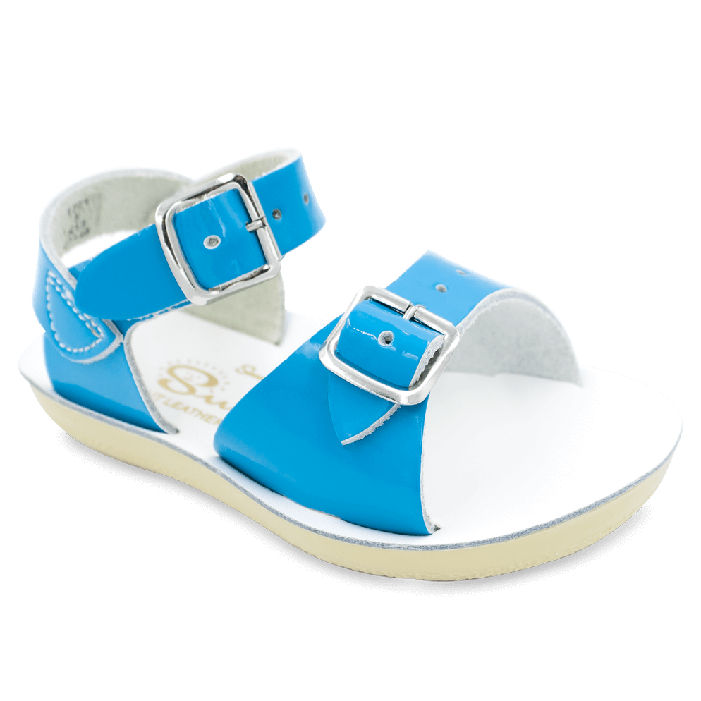 The Sun-San® Surfer is a classic two-strap sandal that’s perfect for younger feet. With an adjustable toe buckle and ankle strap, they are great for both wide and narrow feet. The lightweight, cushioned urethane sole make these comfortable to wear all day long. Rust-proof brass buckles and scuff-resistant, water friendly genuine leather make them ideal for in-and-out of water wear. They clean up so easily, and with proper care will last for years.