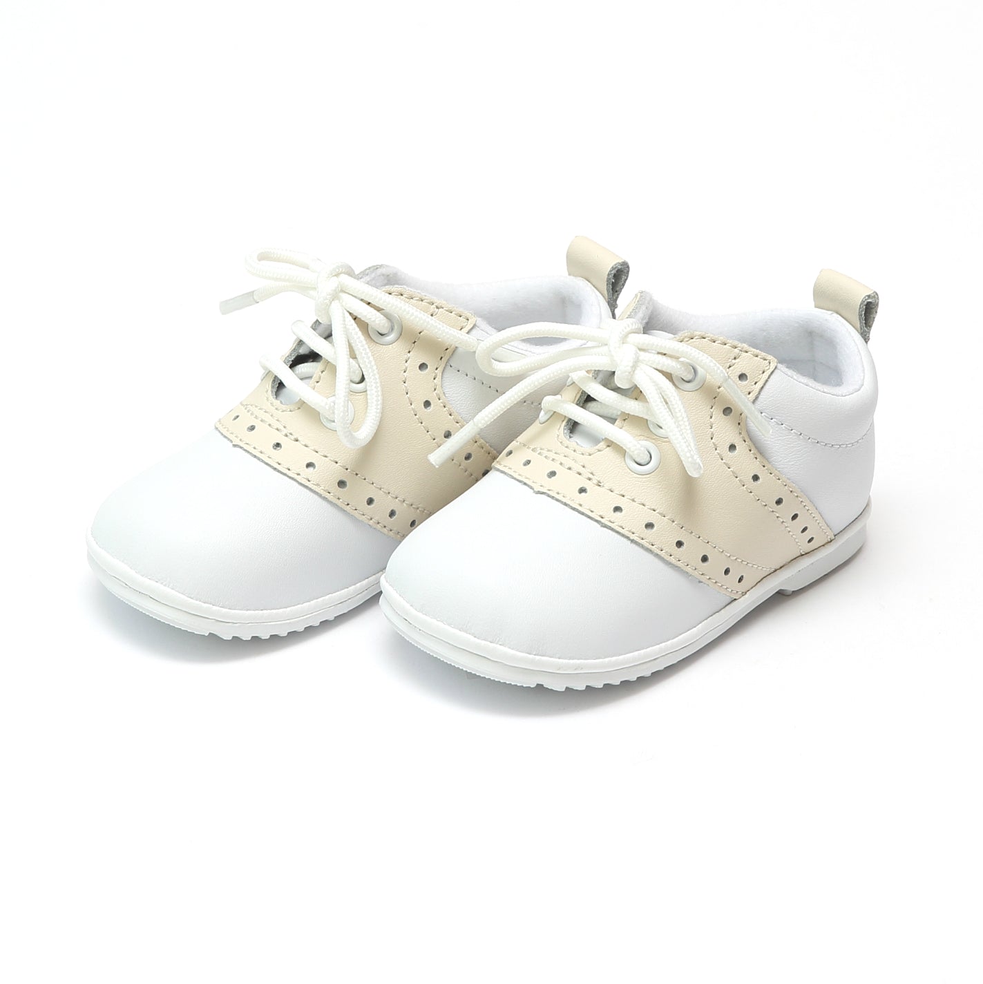 The Austin has stayed true to the look of the traditional saddle shoe, over many years. This is a true classic. With white leather exterior and contrasting leather saddle, Austin is a style that will make your little gent or little lady look absolutely proper! Leather upper Functional lace up front Perforated trim at sides Pull tab at back for easy on/off