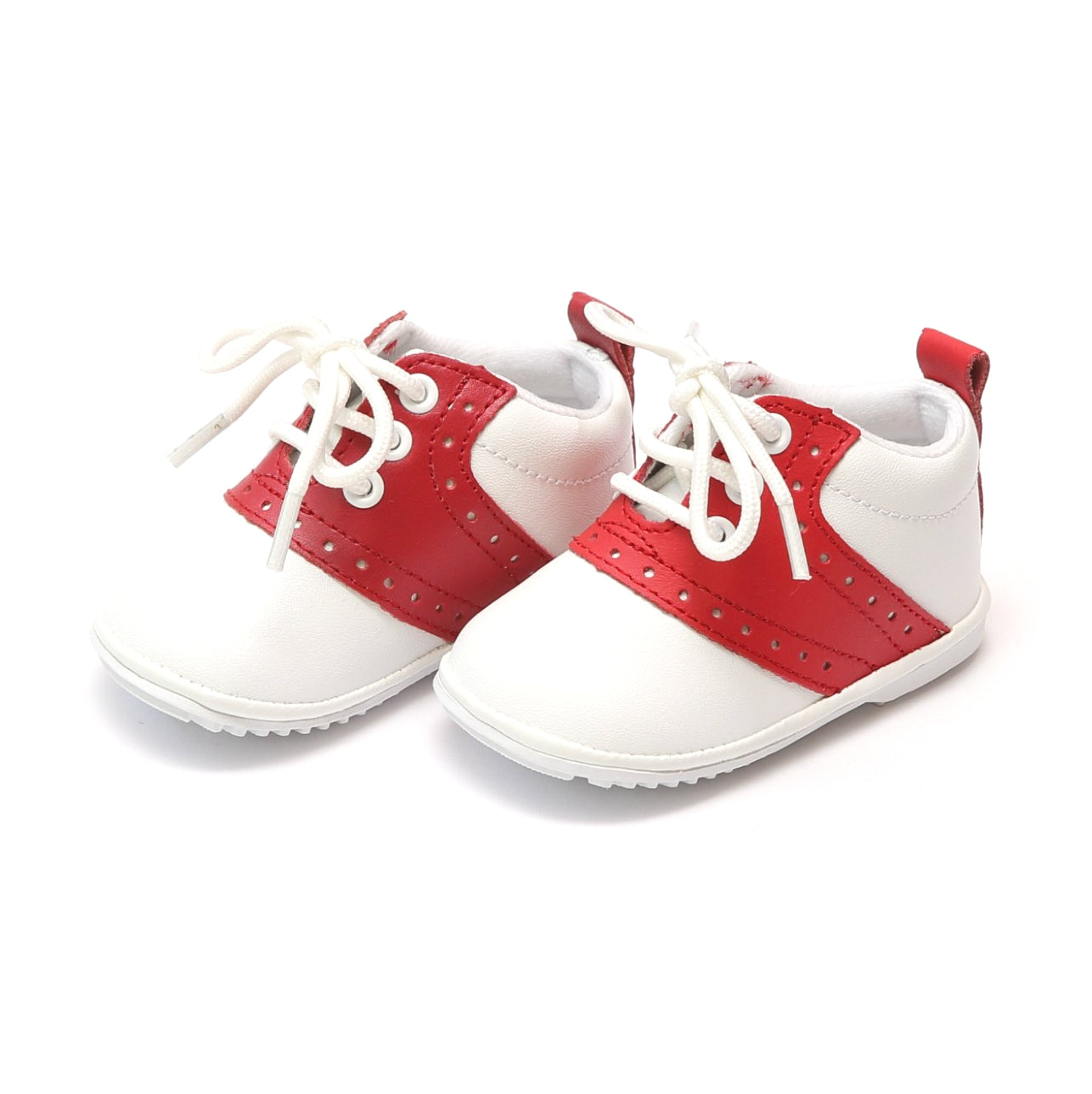 The Austin has stayed true to the look of the traditional saddle shoe, over many years. This is a true classic. With white leather exterior and contrasting leather saddle, Austin is a style that will make your little gent or little lady look absolutely proper! Leather upper Functional lace up front Perforated trim at sides Pull tab at back for easy on/off