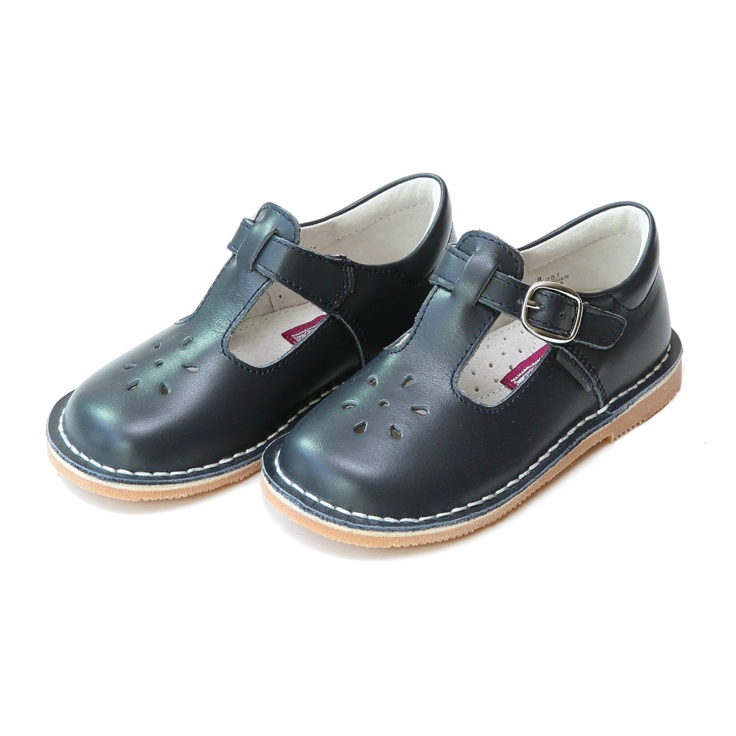 Joy, with its t-strap and perforated design, is an impeccable timeless shoe. With our array of colors, this mary jane can become your child's favorite for any special or casual occasion! Stitch down construction Hook and loop velcro closure Breathable leather lining and sock with arch support