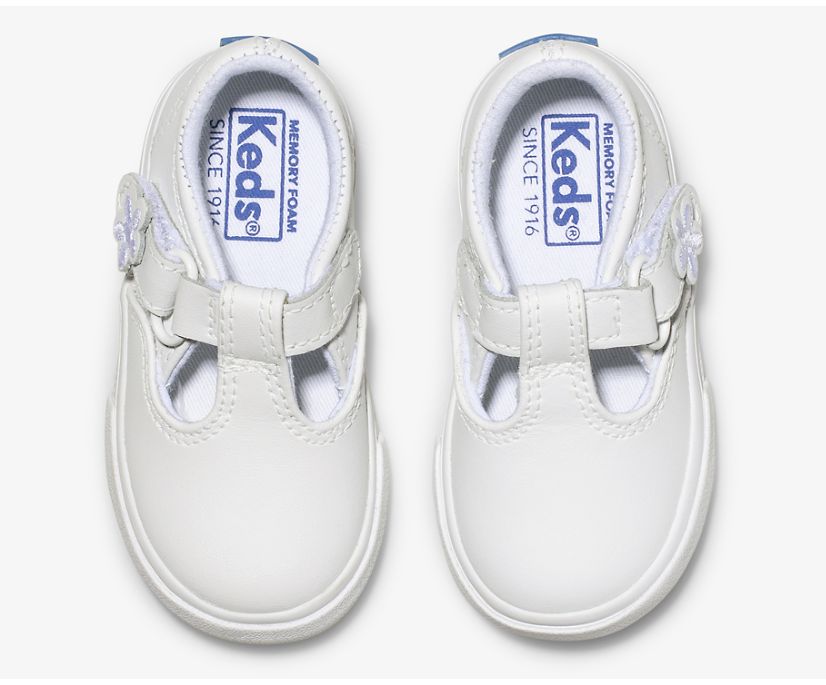 A T-strap twist on the classic Keds’ sneaker, the Daphne will go with whatever she chooses to wear that day. She’ll love the cute flower detail on the easy T-strap closure, and the memory foam footbed will keep her comfy while she braves the day.