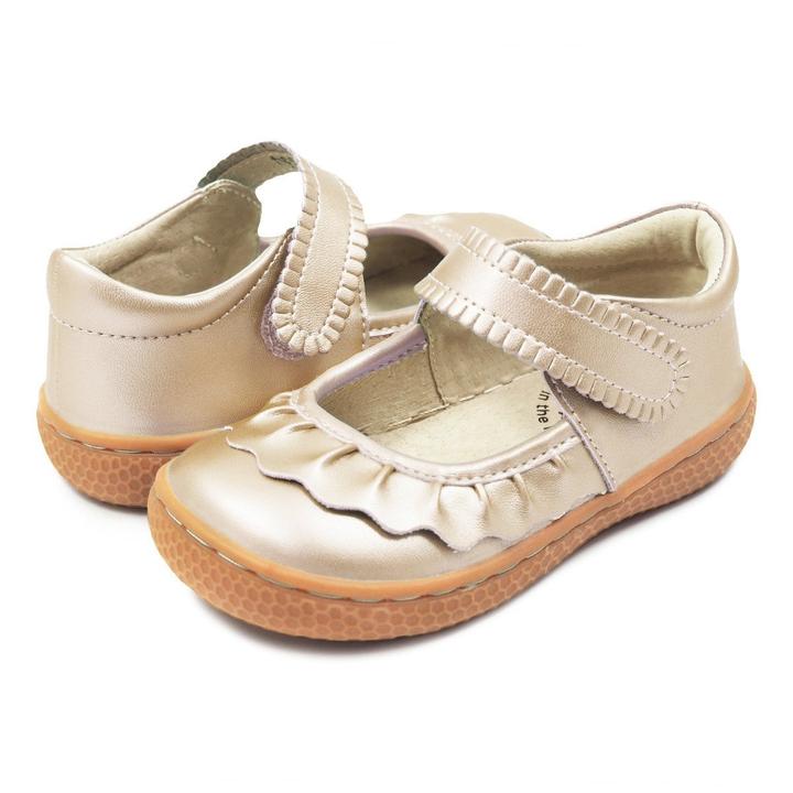If we could only bottle the essence of Ruche... Would it be the ruffles? The scallops, the all-together dainty delightfulness? Whatever it is, she’s the perennially popular playground-to-party shoe. Crafted in soft heritage-quality leathers, she’s kid-tested and approved by the APMA (American Podiatric Medical Association), sure to withstand heavy play and support healthy foot development.