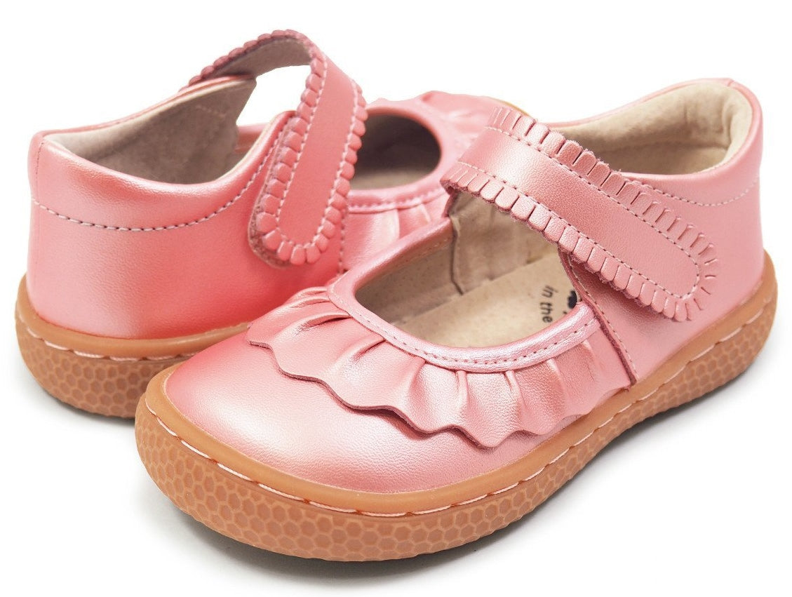If we could only bottle the essence of Ruche... Would it be the ruffles? The scallops, the all-together dainty delightfulness? Whatever it is, she’s the perennially popular playground-to-party shoe.  Crafted in soft heritage-quality leathers, she’s kid-tested and approved by the APMA (American Podiatric Medical Association), sure to withstand heavy play and support healthy foot development.