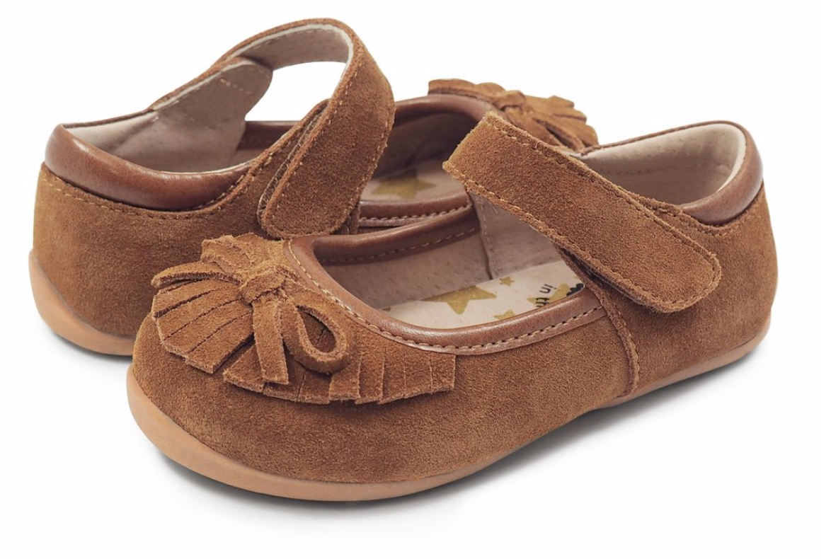 With A Delicate Fringe And Bow “Willow” Is Our Soft And Flexible Moccasin-Style Shoe For Girls! Her Traditional Camel And Butterscotch Suede Options Provide Versatility For Any Occasion. Suede Upper Leather Lining With Gold Stars Synthetic Dancer Outsole Hook And Loop Closure For A Just-Right Fit Padded Collar For Comfort