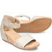 An elevated essential with sleek lines and modern simplicity, Vexie is the sandal you’ll want to live in all summer. It’s wrapped in luxury leathers with a hidden closure for custom comfort and set on a timeless stacked wedge to complement your favorite looks. Textured metallic perforated leather Adjustable hook-and-loop strap Leather lining Leather-lined footbed, with raised foam for added visible comfort Flexible, slip-resistant TPR outsole Cork-wrapped wedge Heel Height: 2 inches