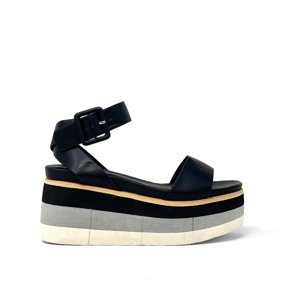 Made from ultra supple faux leather, JENNIFER's delicate yet robust straps are set atop comfortable color-blocked flatform soles. Perfect for long summer days (and nights!).