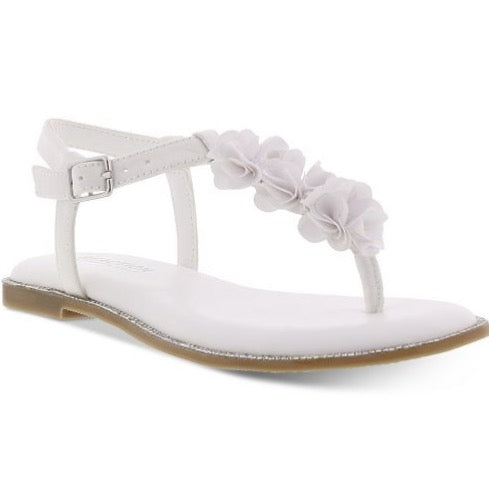 A cushioned insole adds comfort to these T-strap sandals from Kenneth Cole, styled with flower details and faux gem stones for extra flair. · Floral detailing · Buckle at back strap · Cushioned insole · Manmade upper and lining; rubber sole · Imported