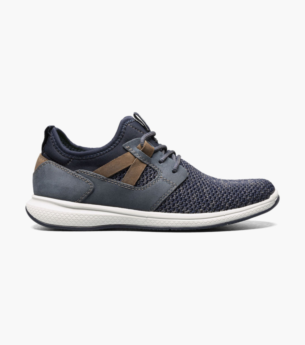 Step into a new world of style and comfort with the Florsheim Great Lakes Knit Plain Toe Sneaker, Jr. Featuring a hybrid sneaker design with an athletic-inspired sole, this is a shoe style he needs in his closet.