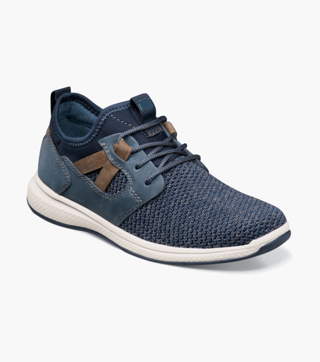 Step into a new world of style and comfort with the Florsheim Great Lakes Knit Plain Toe Sneaker, Jr. Featuring a hybrid sneaker design with an athletic-inspired sole, this is a shoe style he needs in his closet.