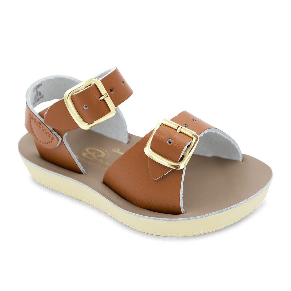 The Sun-San® Surfer is a classic two-strap sandal that’s perfect for younger feet. With an adjustable toe buckle and ankle strap, they are great for both wide and narrow feet. The lightweight, cushioned urethane sole make these comfortable to wear all day long. Rust-proof brass buckles and scuff-resistant, water friendly genuine leather make them ideal for in-and-out of water wear. They clean up so easily, and with proper care will last for years.