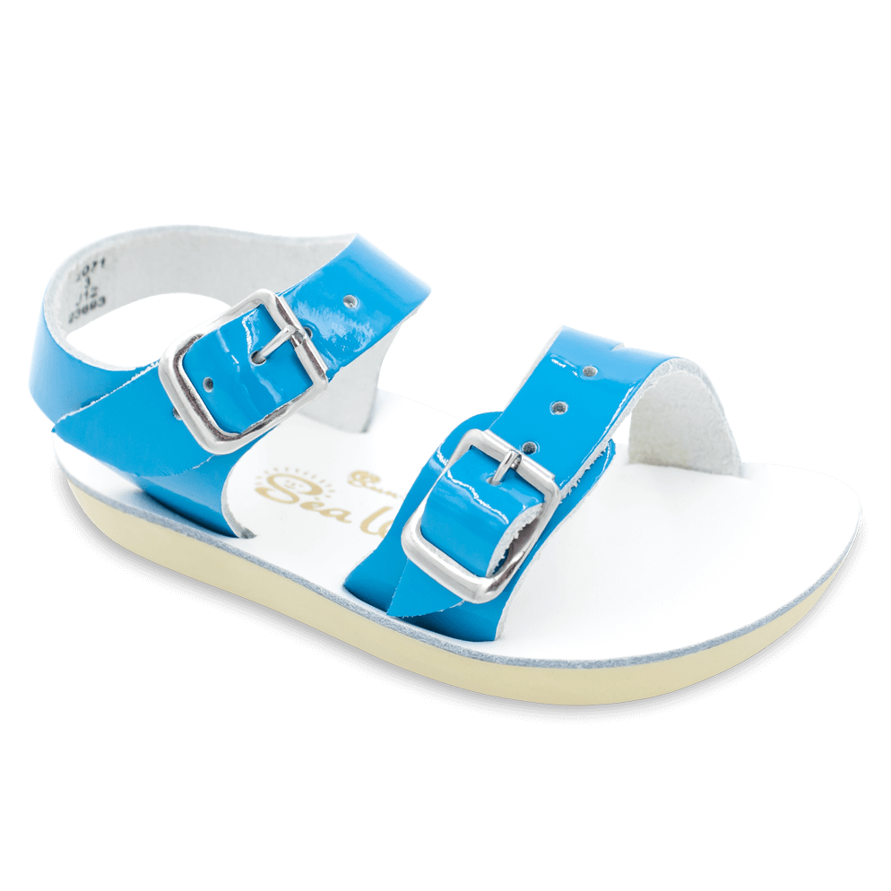 The Sun San® Sea Wee is made only in the smallest baby sizes. We have added flex over the toe making this little sandal a perfect starter pair for your tiny adventurer. A lightweight, cushioned urethane sole, rust-proof brass buckles, and scuff-resistant water friendly genuine leather make these sandals ideal for in-and-out of water wear. The Sea Wee is one of our best-selling baby sandals. Both boys and girls can wear these with anything and look great.