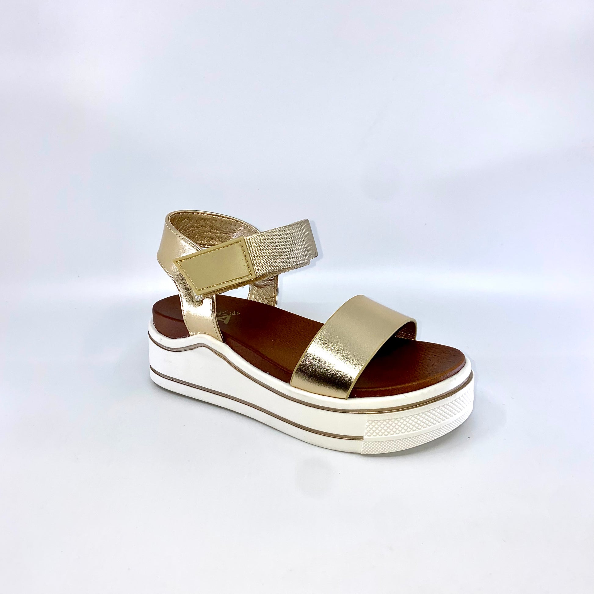 The trendy Mia® Kids HAYLO platform sandal will pull together your look perfectly.  Man-made upper. Velcro buckle. Lightly padded man-made lining. Open toe. Durable man-made outsole. Imported.