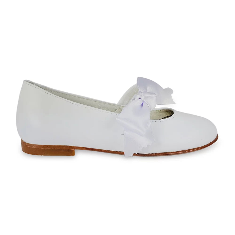 The feminine satin bow detail in this white  shoe  will perfectly complement any outfit.  With the bow  the shoe will be perfect for attending any party, holiday, or wedding. You can remove the bow and your child will be ready to walk to school.  Its soft leather construction promotes natural movement and proper foot development.  They have a rubber sole, and cushioned insole.  Each Geppetto’s shoe is handcrafted by our expert shoemakers with only the finest luxury materials.