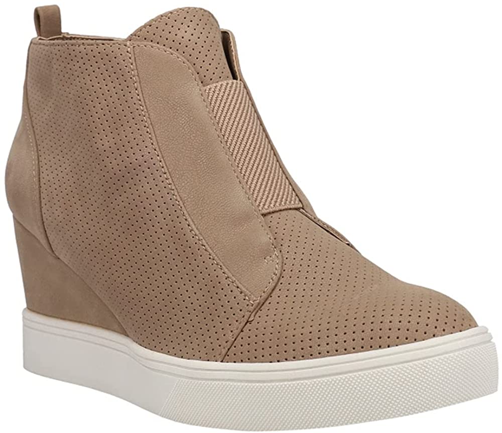Finally, the comfortable sneaker your foot wants mixed with the chic style your eyes want *Faux leather upper with perforated paneling *Inside zip closure with elastic goring on vamp for a secure fit *Lightly cushioned footbed *2-3/4" wedge heel.