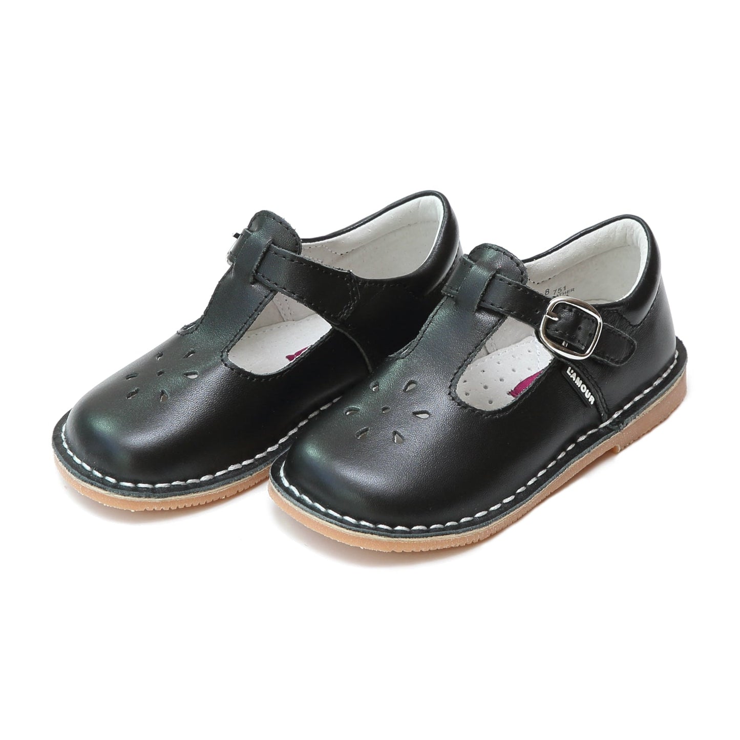 Joy, with its t-strap and perforated design, is an impeccable timeless shoe. With our array of colors, this mary jane can become your child's favorite for any special or casual occasion!  Stitch down construction Hook and loop velcro closure Breathable leather lining and sock with arch support