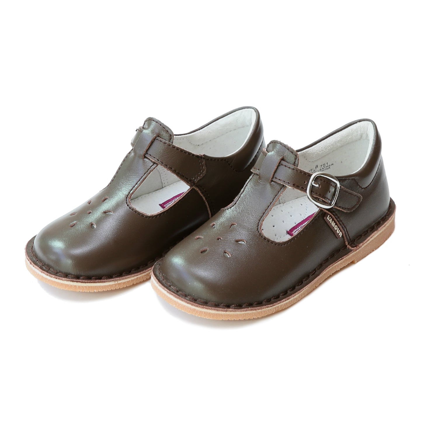 Joy, with its t-strap and perforated design, is an impeccable timeless shoe. With our array of colors, this mary jane can become your child's favorite for any special or casual occasion!  Stitch down construction Hook and loop velcro closure Breathable leather lining and sock with arch support