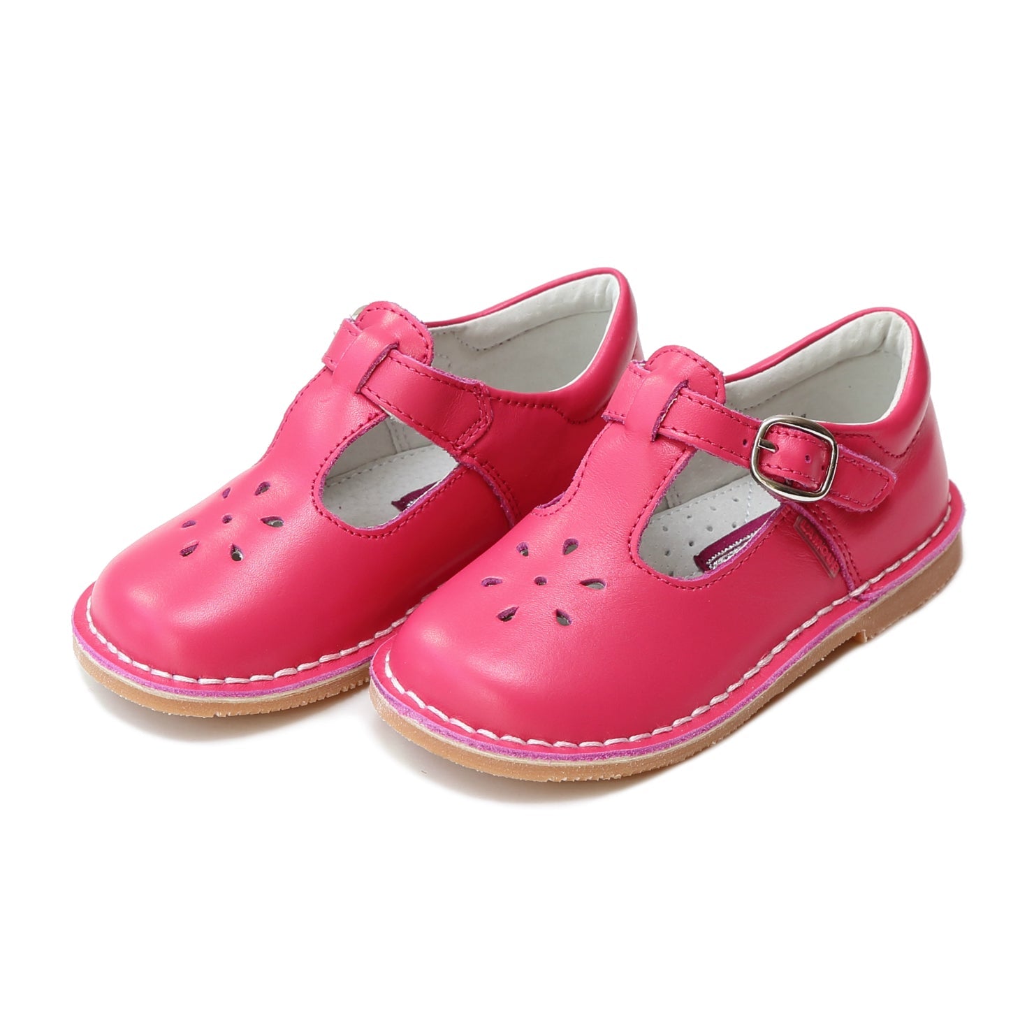 Joy, with its t-strap and perforated design, is an impeccable timeless shoe. With our array of colors, this mary jane can become your child's favorite for any special or casual occasion!  Stitch down construction Hook and loop velcro closure Breathable leather lining and sock with arch support