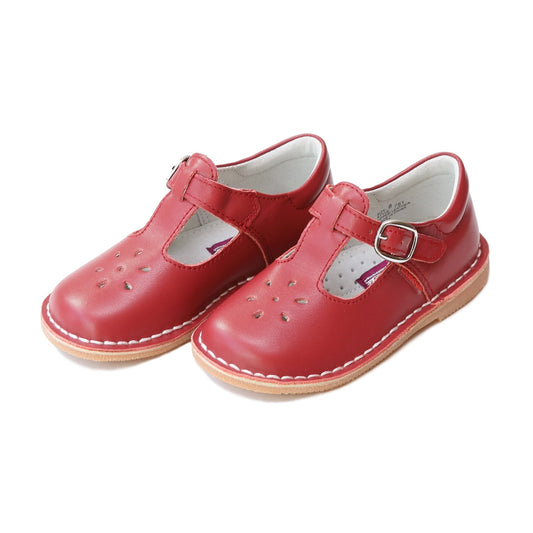 Joy, with its t-strap and perforated design, is an impeccable timeless shoe. With our array of colors, this mary jane can become your child's favorite for any special or casual occasion!  Stitch down construction Hook and loop velcro closure Breathable leather lining and sock with arch support