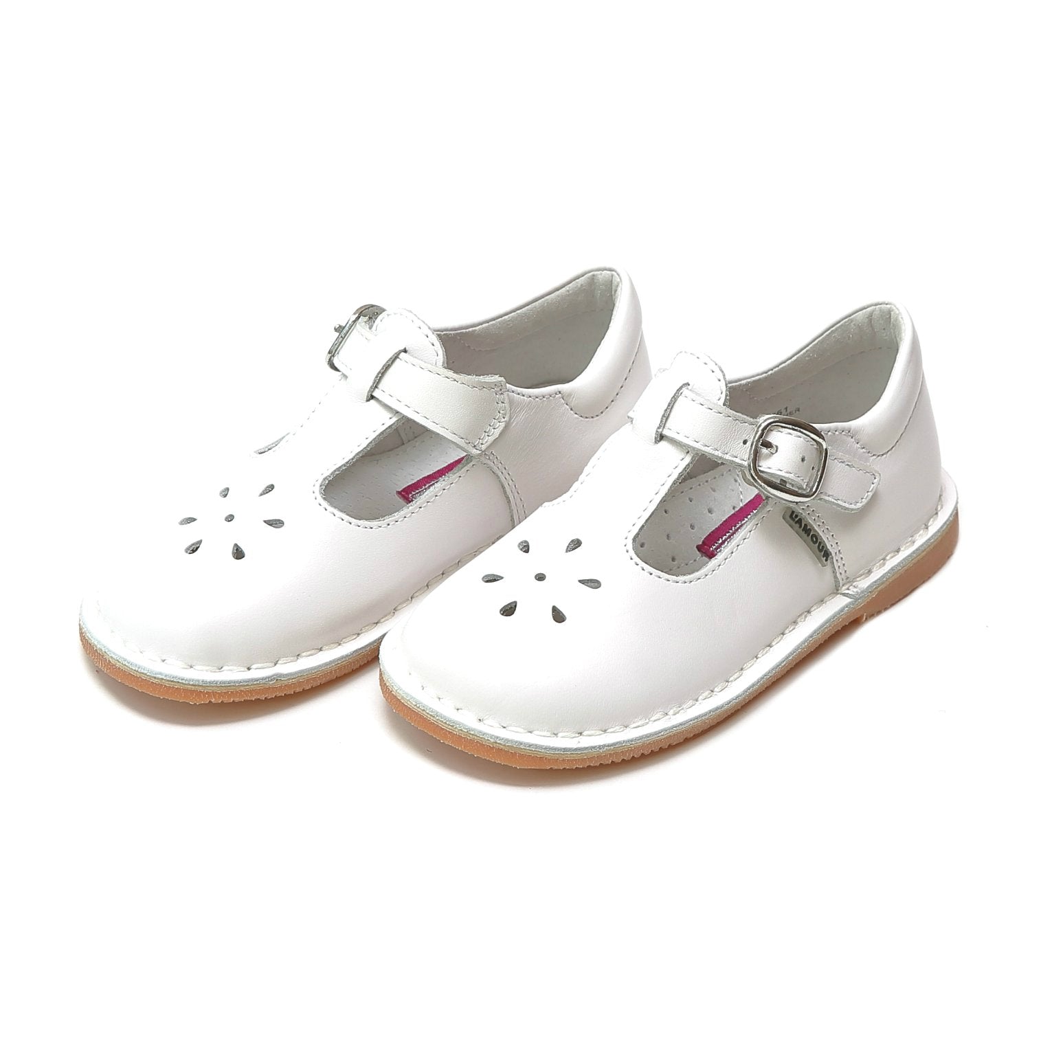 Joy, with its t-strap and perforated design, is an impeccable timeless shoe. With our array of colors, this mary jane can become your child's favorite for any special or casual occasion!  Stitch down construction Hook and loop velcro closure Breathable leather lining and sock with arch support