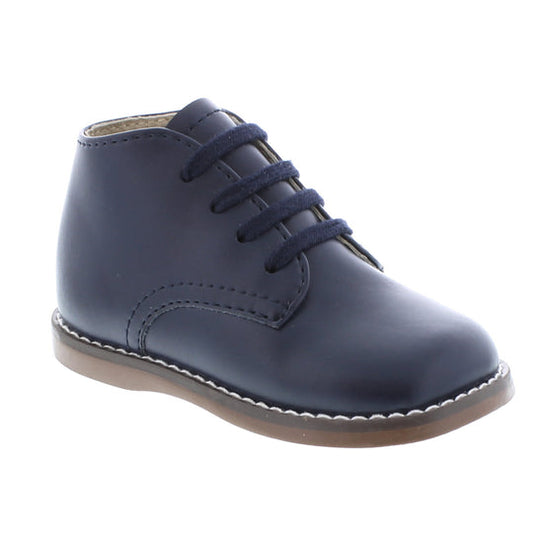 Custom Fit System – Removable, dual insoles in Medium and Wide provided for customized fitting. Roomy Toe Box – Allows tiny toes room to breathe and splay naturally during walking, enhancing balance and reducing rubbing, friction, and moisture. Arch Support – Shoe last and insole designed to provide proper arch support for developing feet. High-quarter design provides maximum support and stability for first-walkers.
