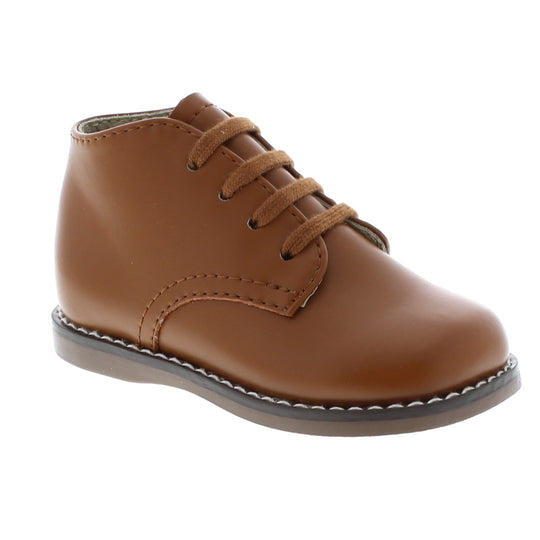 Custom Fit System – Removable, dual insoles in Medium and Wide provided for customized fitting. Roomy Toe Box – Allows tiny toes room to breathe and splay naturally during walking, enhancing balance and reducing rubbing, friction, and moisture. Arch Support – Shoe last and insole designed to provide proper arch support for developing feet. High-quarter design provides maximum support and stability for first-walkers.