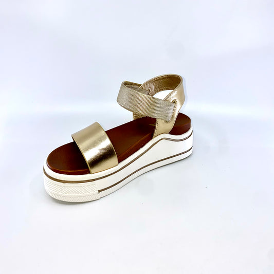 The trendy Mia® Kids HAYLO platform sandal will pull together your look perfectly.  Man-made upper. Velcro buckle. Lightly padded man-made lining. Open toe. Durable man-made outsole. Imported.