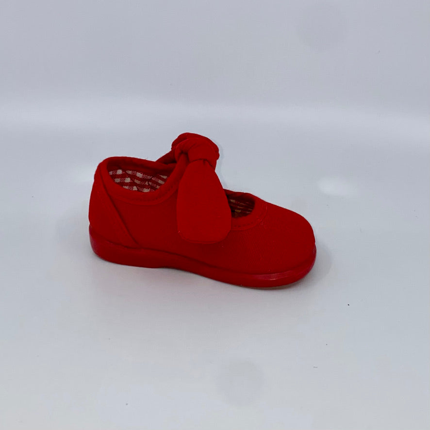 Canvas -Lightweight and comfy red bow Mary Jane canvas  upper - Buckle strap -Textile lining and padded insole. - Smooth traction rubber sole -Rounded toe -Made in Spain