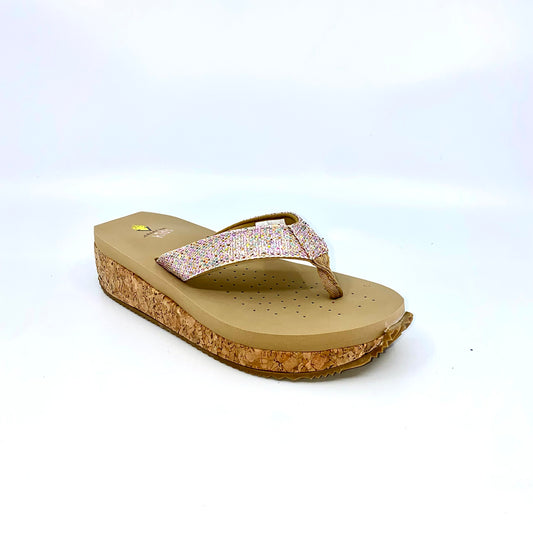 This wedge thong sandal by Volatile is crafted in a textured synthetic python material adorned with cased jewels and studs. They feature Volatile’s signature ultra comfort EVA insole for all day comfort, padded textile lining and nonskid rubber traction outsoles to keep you at your best on your feet. Feel free to dress these up or down for any occasion.