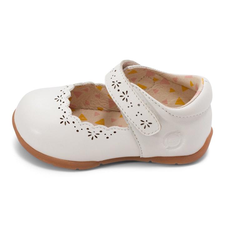 Lily is from the new First Walker Collection at Livie and Luca. With delicate flower perforations and sweet scallops, Lily is a lovely toddler shoe that can be dressed up or down. On the new First Walker sole which is a thin, flexible, minimalist sole. It is however significantly narrower than other Livie and Luca soles.