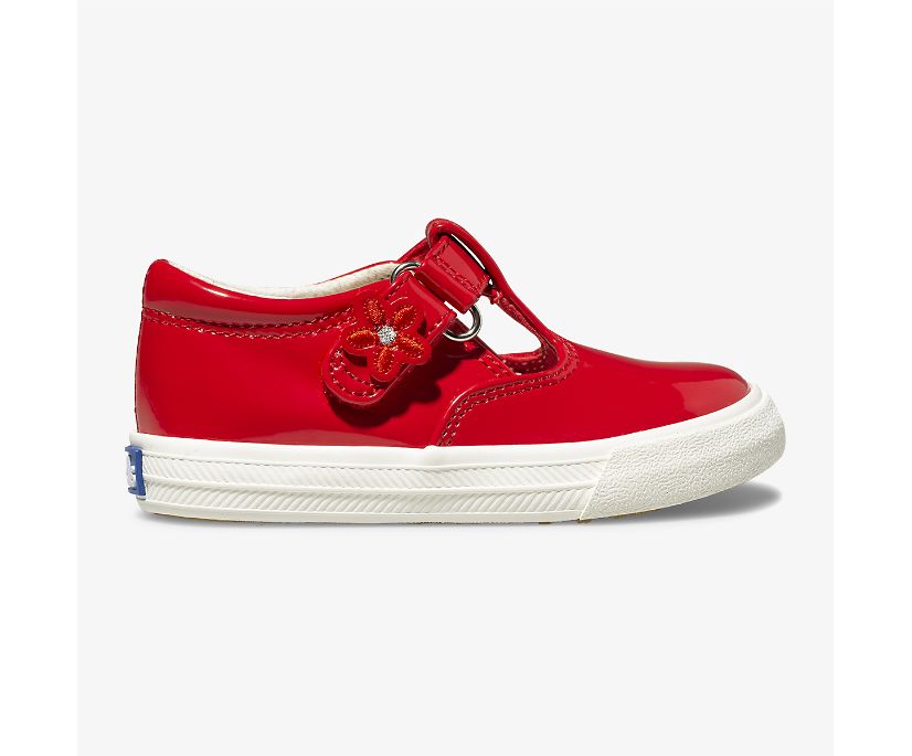 A T-strap twist on the classic Keds’ sneaker, the Daphne will go with whatever she chooses to wear that day. She’ll love the cute flower detail on the easy T-strap closure, and the memory foam footbed will keep her comfy while she braves the day.