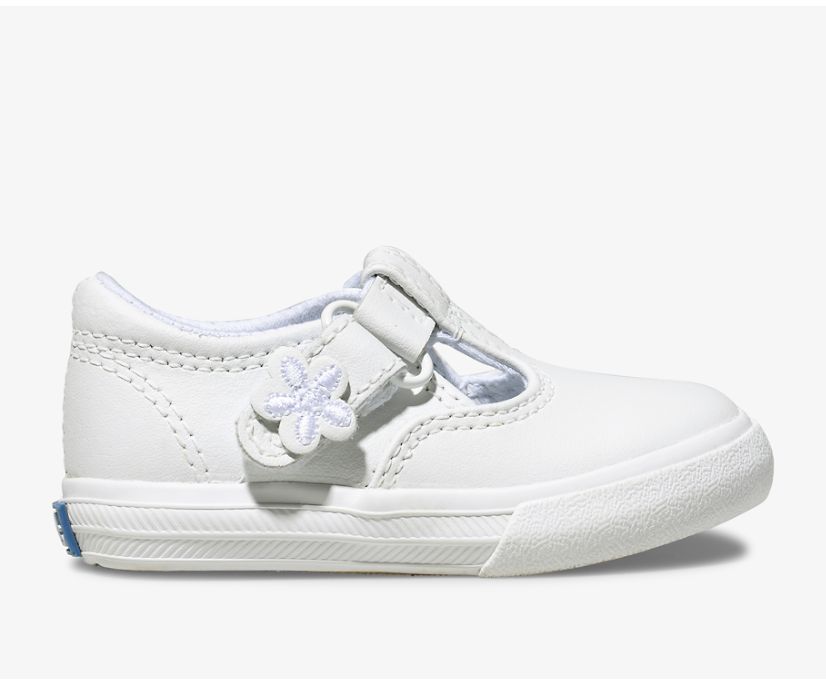 A T-strap twist on the classic Keds’ sneaker, the Daphne will go with whatever she chooses to wear that day. She’ll love the cute flower detail on the easy T-strap closure, and the memory foam footbed will keep her comfy while she braves the day.