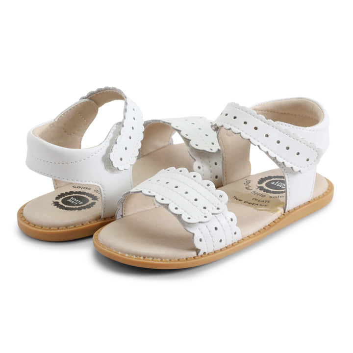 Posey is a precious vintage eyelet dress transformed into an everyday summer sandal. Comfort-focused with a cushioned footbed and front and back velcro straps allowing you to truly customize your fit. Did we mention that it matches everything?