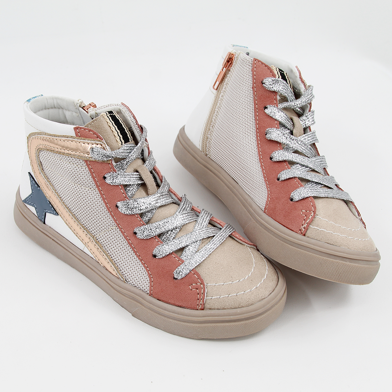 A fun sneaker that can be dressed up or down. Features silver laces, suede detailing, and side zipper.