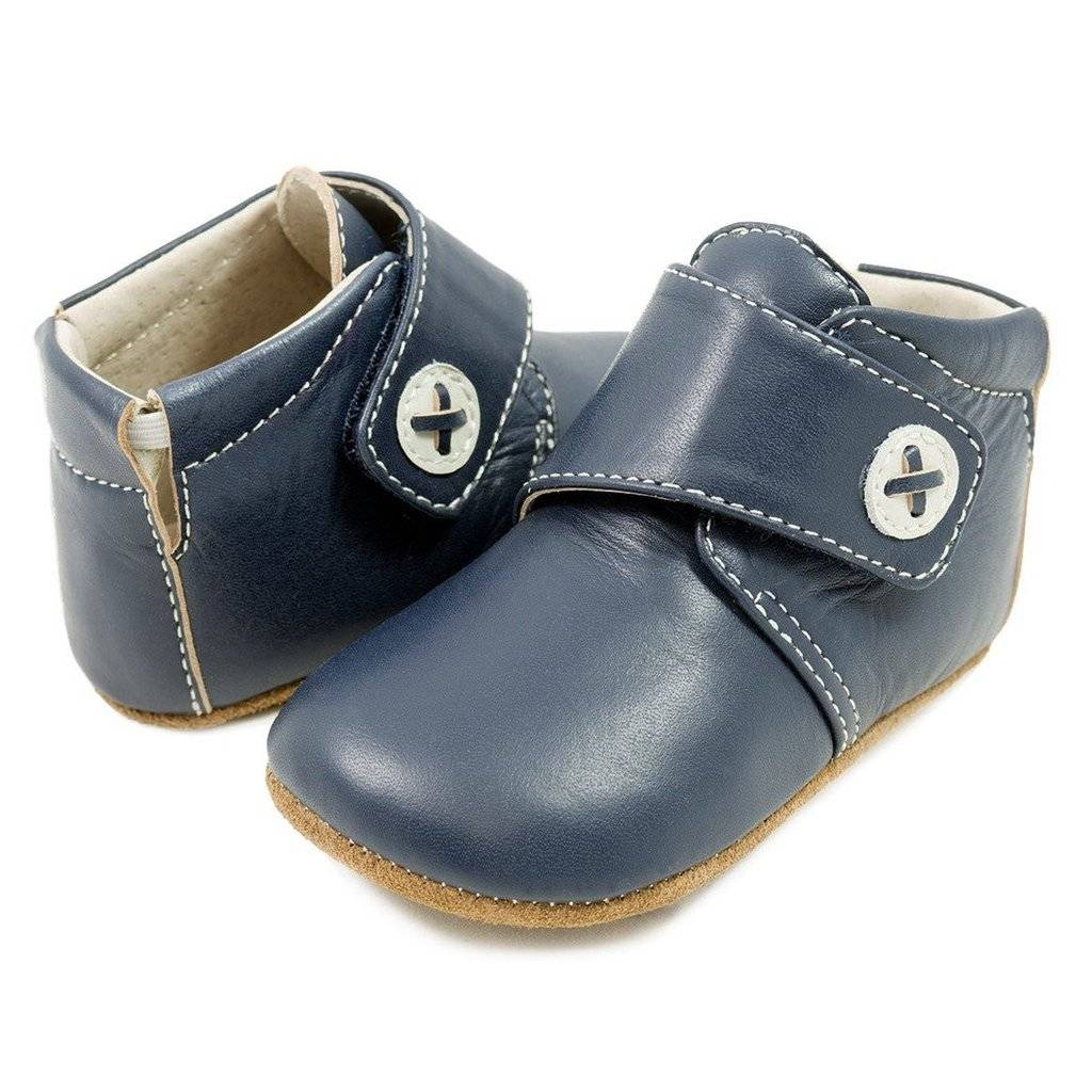 Help your little one step through the day in lightweight comfort with these booties offering a breathable leather lining and padded elastic collar for easy on and off.  Padded elastic collar Suede upper Leather lining Rubber sole Imported