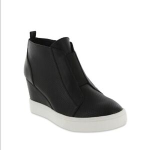 Finally, the comfortable sneaker your foot wants mixed with the chic style your eyes want *Faux leather upper with perforated paneling *Inside zip closure with elastic goring on vamp for a secure fit *Lightly cushioned footbed *2-3/4" wedge heel.