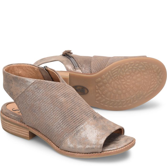 Laid-back style and must-have comfort come together effortlessly in our lovely Bohemian-inspired Natalia sandal.  This go-to transitional style is detailed with embossed leathers for an on-trend look and zips on and off with ease.  Details Offered in Italian leather or distressed metallic suede Inside zipper Leather lining Leather-lined footbed, cushioned for extra comfort Lightweight, flexible TPR outsole Leather stacked heel Heel height: 1 ¼ inches