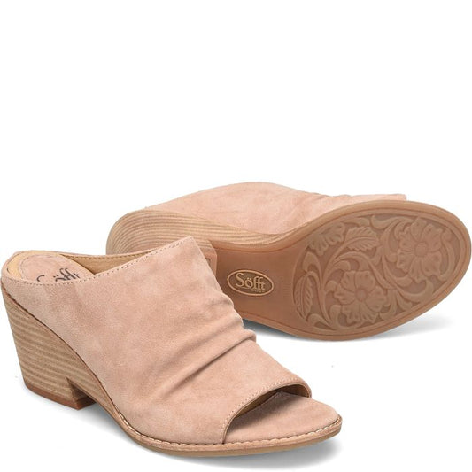 Luxe Italian leathers make this modern ruched slide irresistible.  The Strathmore’s unique wedge-inspired silhouette gives it a one-of-a-kind look.  Details Offered in Italian leathers and Italian suedes Microfiber lining Leather-lined footbed, cushioned at ball, heel and arch for extra support Lightweight TPR outsole Stacked cut-out wedge heel Heel Height: 3 inches